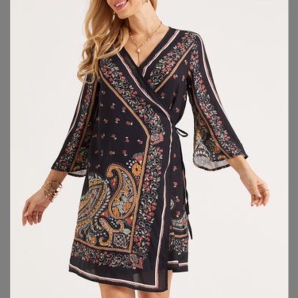 NWOT wrap dress with asymmetric hem.